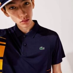 Polo Lacoste Sport Colorblock Bleu Marine / Jaune / Orange 9 Polo Lacoste Sport Colorblock Bleu Marine / Jaune / Orange -Tennis Équipement Magasin polo lacoste sport colorblock bleu marine jaune orange 2